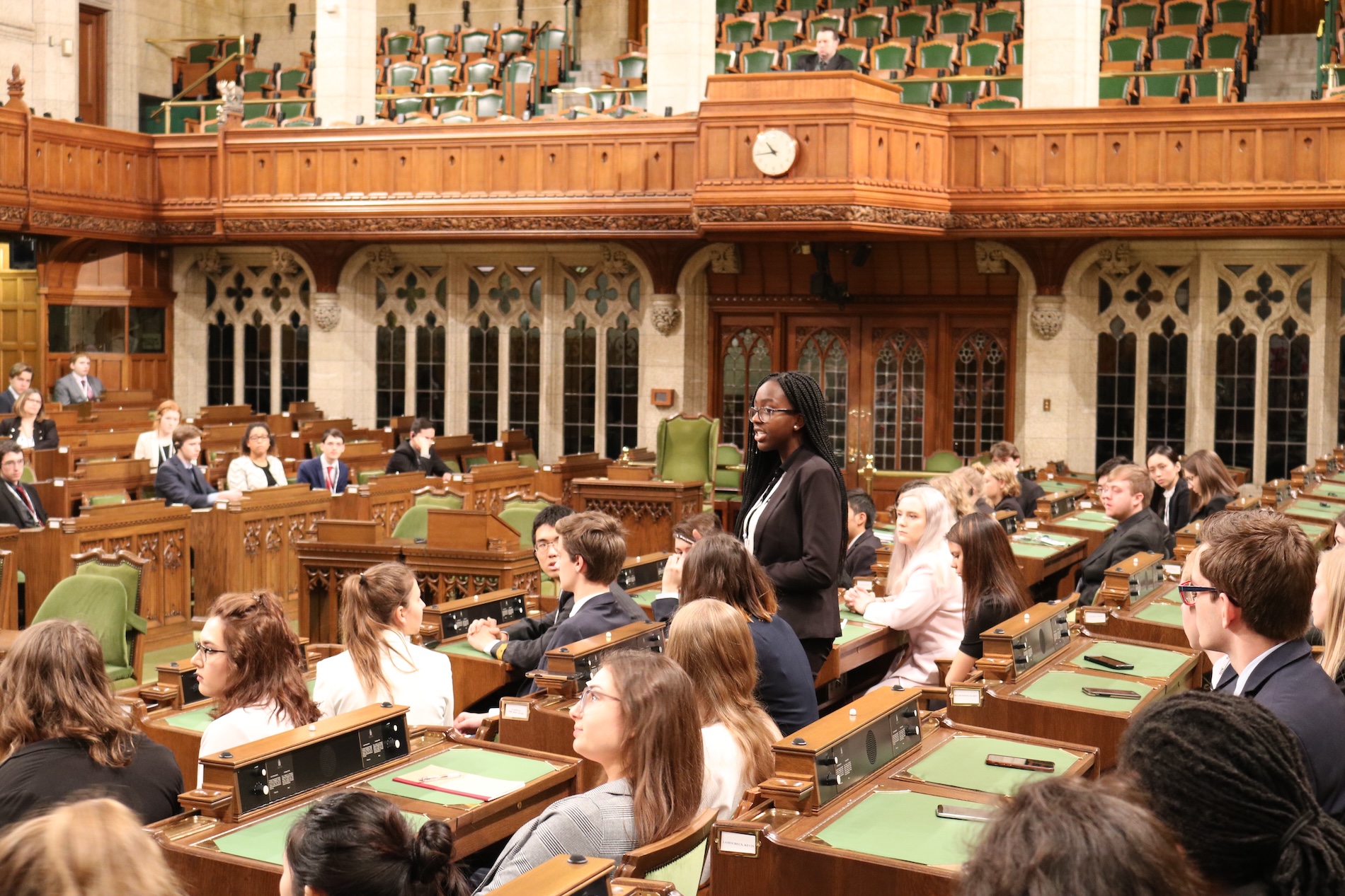A photo of students inside the Chamber of Commons having a meeting.